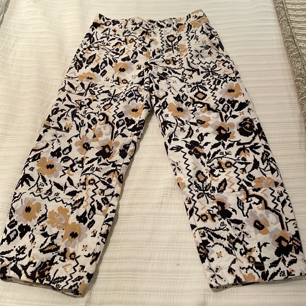 Anthropologie brushed cords in brown and yellow print.